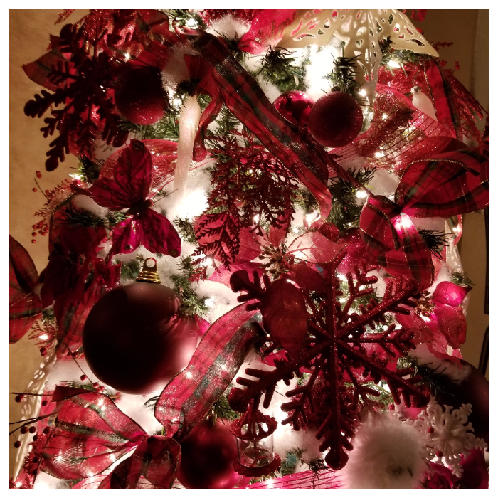 red and white snowflake Christmas tree at night