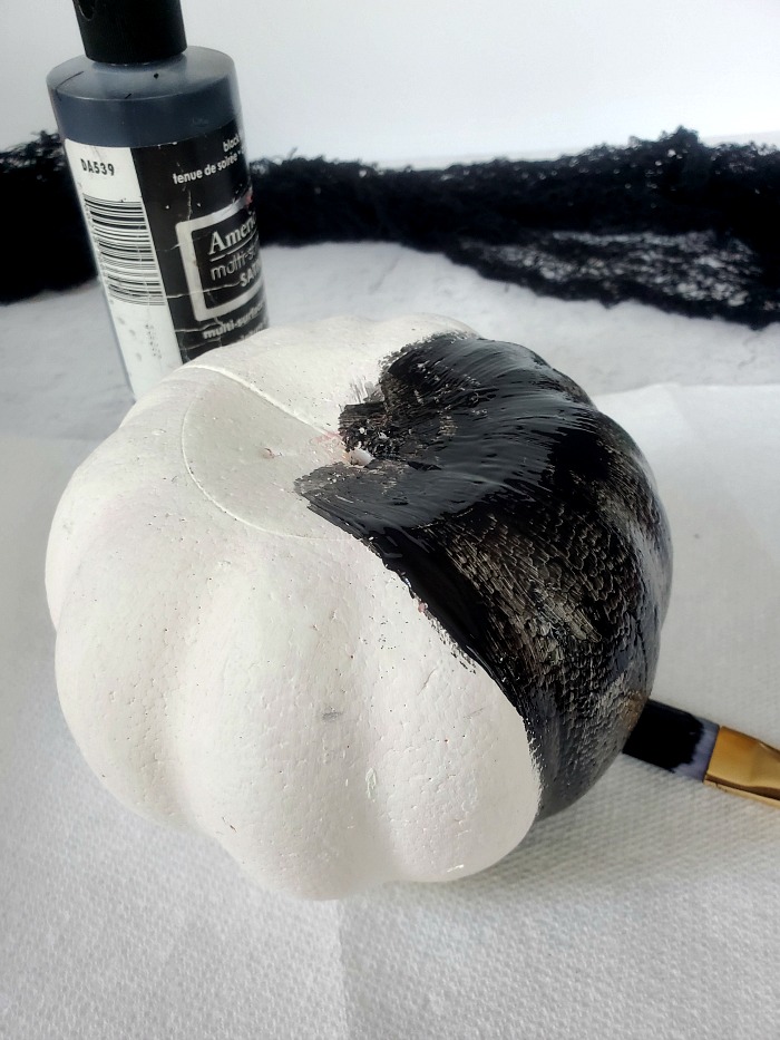 Painting foam pumpkin black