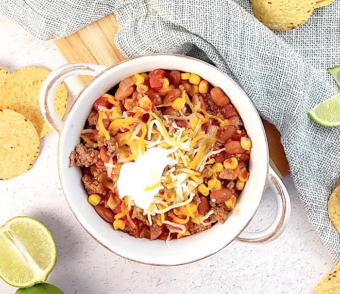 EASY SLOW COOKER TACO SOUP IN WHITE BOWL