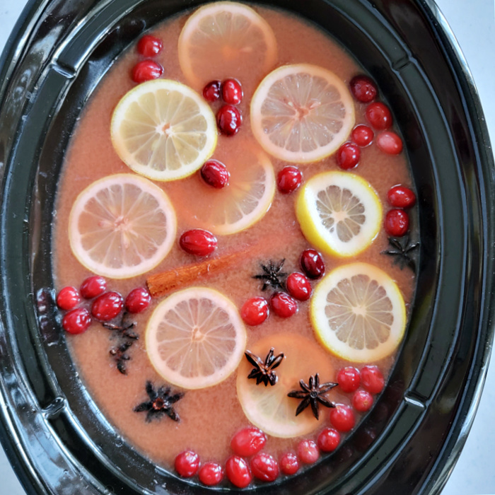 slow cooker hot cranberry fruit punch overhead in slow cooker