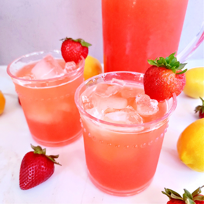 Closeup of two strawberry lemonade cups