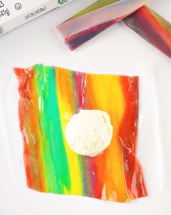 Fruit roll-ups with vanilla ice cream in the  center.

