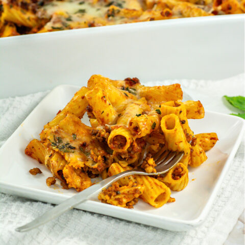 Closeup of Baked Rigatoni on a white plate.