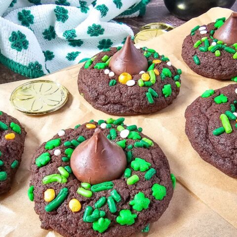 St. Patrick's Day Chocolate Blossom Cookies closeup on parchment paper.